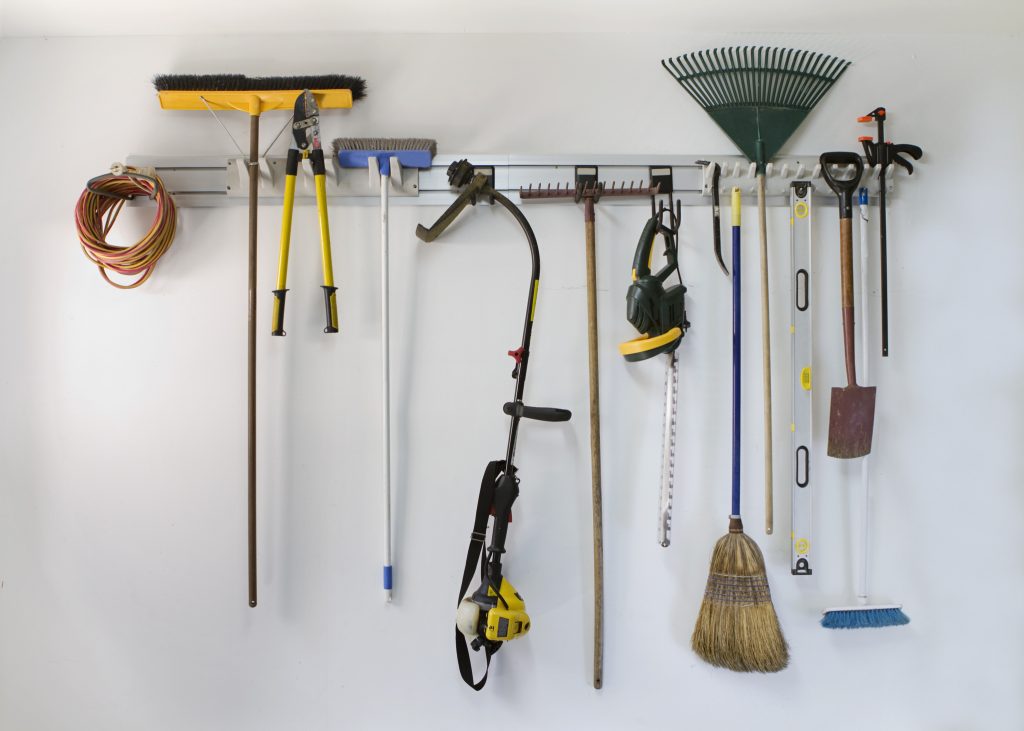 Neat garage tools hanging on a storage rack home storage solutions