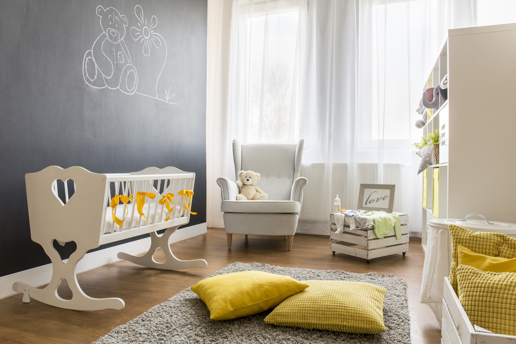 Shot of a spacious modern nursery room with a chalkboard wall