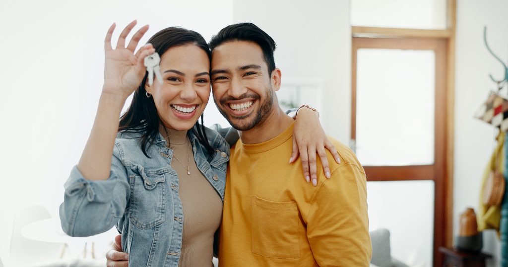 Love, keys and excited with couple in new house for moving, real estate and investment. Property, happy and future with portrait of man and woman at home for opportunity, success or marriage together buying a new home