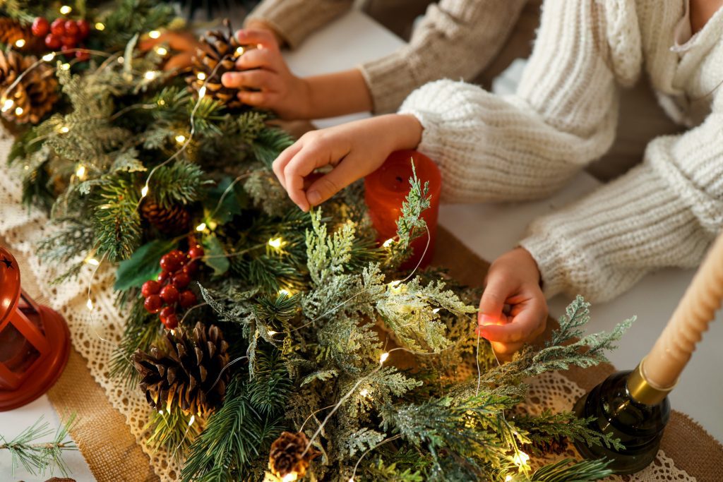 holiday read home, Children making a Christmas wreath, festive mood.